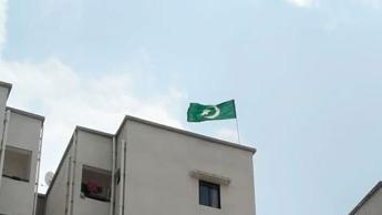 An Arabic flag was installed on the roof of a ...